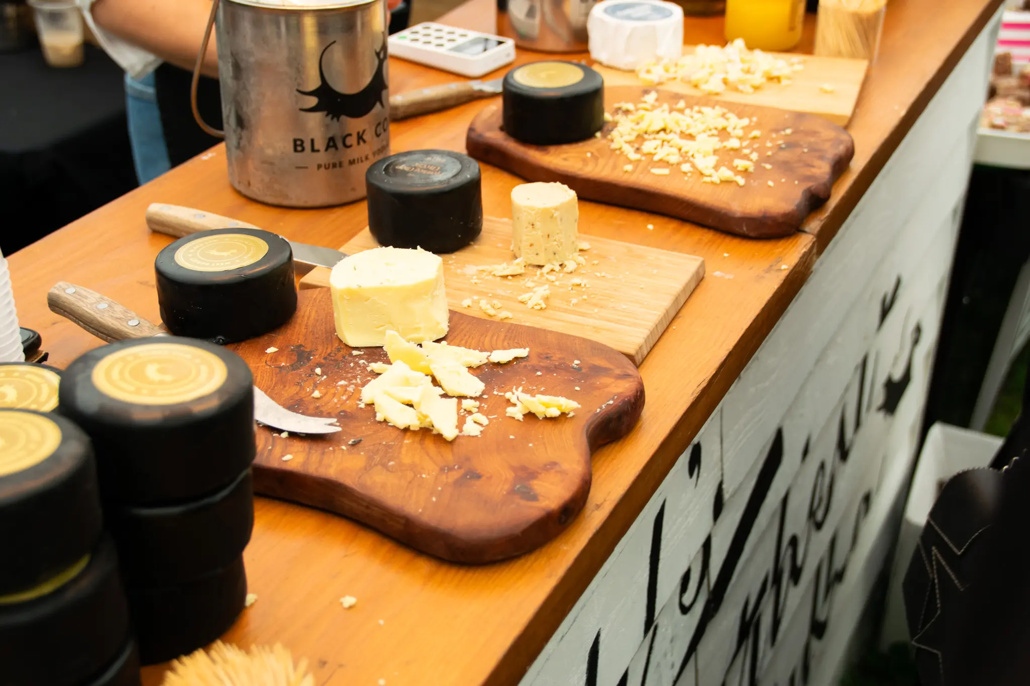 Assorted cheeses on display table