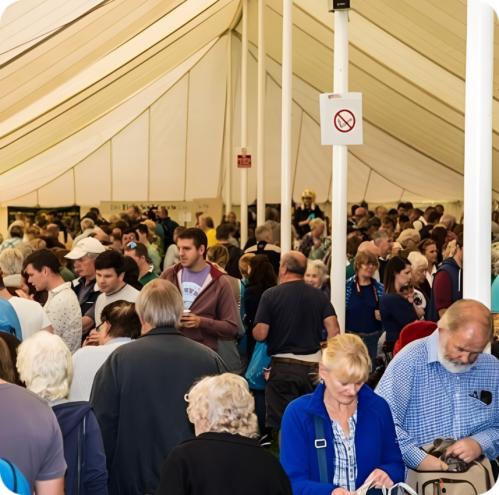 Busy indoor gathering with many attendees