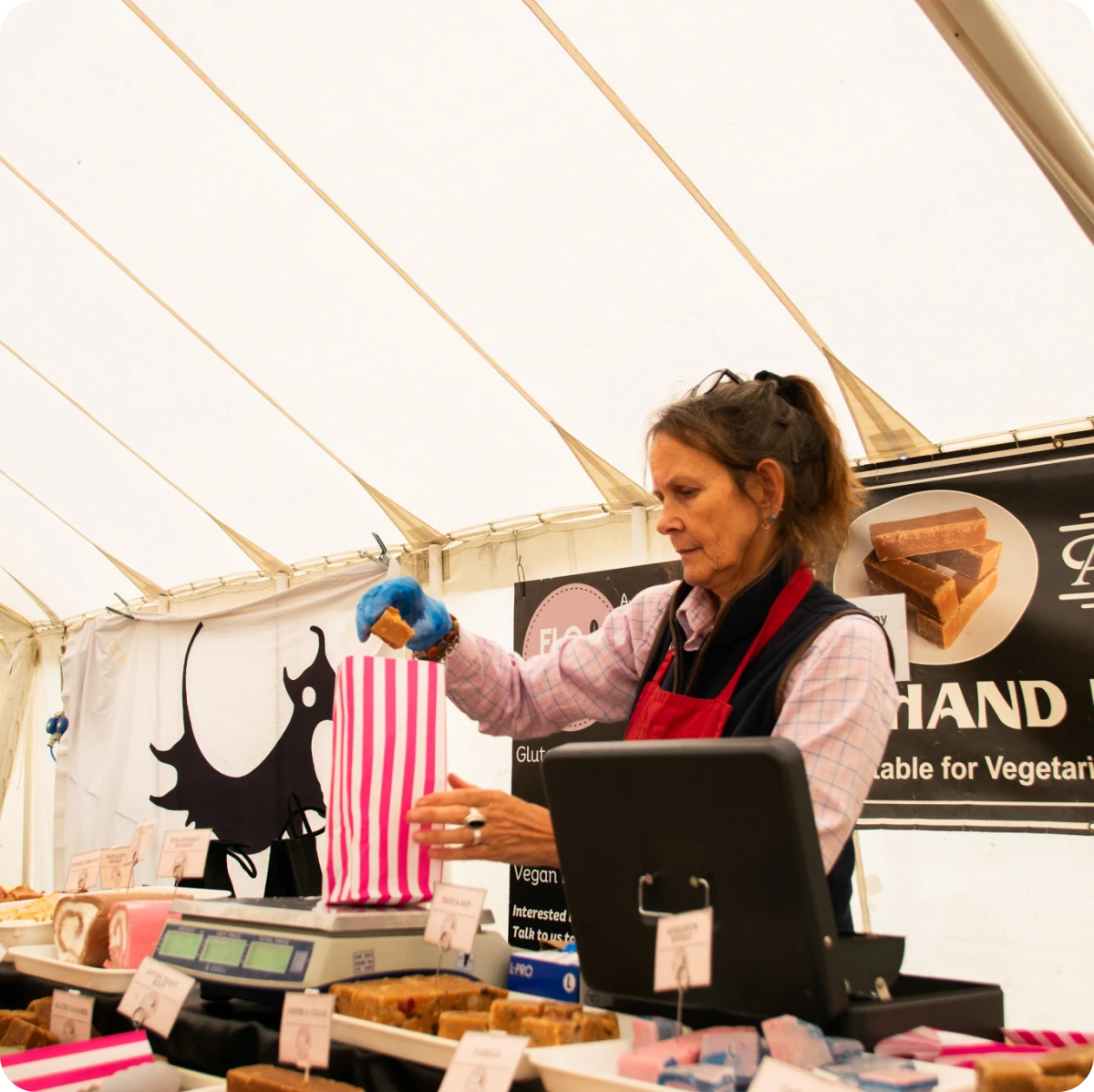 Woman packing candy into striped bag